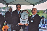 Bill Warner and Stirling Moss admiring R&T Magazine’s &ldquo;The Car We Would Most Like To Drive&rdquo; trophy designed and hand-fabricated by Dwight H. Bennett for the first Amelia Island Concours d’Elegance.
